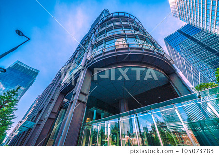 Tokyo cityscape in Japan July. Intense heat... View of Tokyo Station reflected in the glass windows of Marunouchi, Tokyo, and the Shin-Marunouchi Building Tokyo cityscape in Japan July. Intense heat... View of Tokyo Station reflected in the glass windows of Marunouchi, Tokyo, and the Shin-Marunouchi Building 105073783