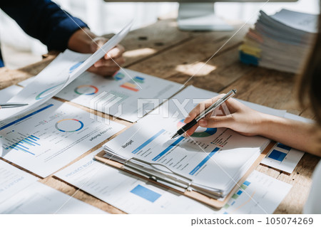 startup business, business team planning teamwork paperwork audit and discussing marketing, profit, budget of company in meeting room 105074269