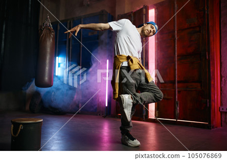 Cool Hip hop dancer in trendy street clothes dancing Cool Hip hop dancer in trendy street clothes dancing 105076869