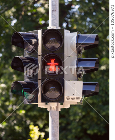 An image of a devil with horns and a tail at a traffic light in Vernigorod. An image of a devil with horns and a tail at a traffic light in Vernigorod. 105076973