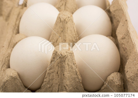 six eggs in a tray for ten eggs isolate 105077174