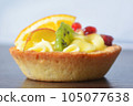 cake with cream and fruit in a basket 105077638