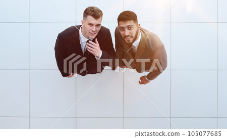 Portrait of two concentrated businessmen partners dressed in formal suit 105077685