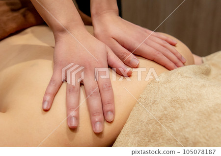 Woman receiving a massage at a beauty salon Woman receiving a massage at a beauty salon 105078187