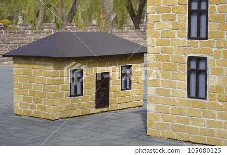 model of one-story open-air house in the park. reconstruction of the city block 105080125