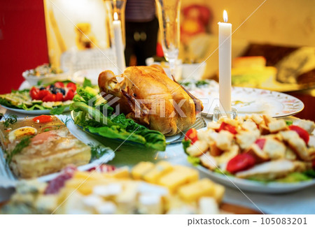Roasted whole turkey on festive table for Thanksgiving Day. 105083201