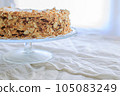 napoleon cake, round whole with caramel cream on a white background. copy space 105083249