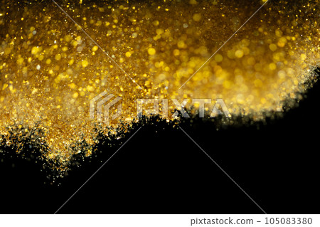 Explosion metallic gold glitter sparkle. Golden Glitter powder spark blink celebrate, blur foil explode in air, fly throw gold glitters particle. Black background isolated, selective focus Blur bokeh Explosion metallic gold glitter sparkle. Golden Glitter powder spark blink celebrate, blur foil explode in air, fly throw gold glitters particle. Black background isolated, selective focus Blur bokeh 105083380