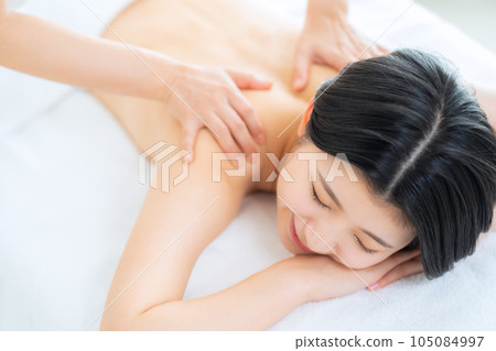 A young woman receiving an esthetics A young woman receiving an esthetics 105084997