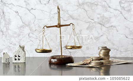 Balance, two house accessories and money_marble background Balance, two house accessories and money_marble background 105085622