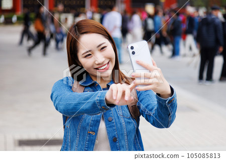 A woman taking self-taking A woman taking self-taking 105085813