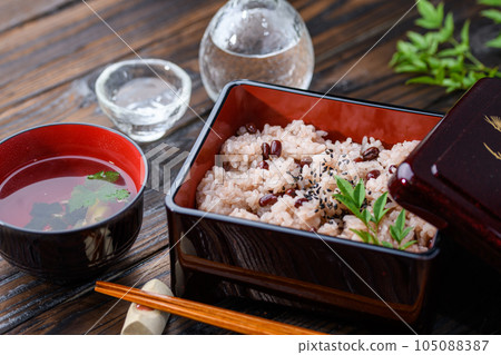 Sekihan served in a box (with Japanese sake) Sekihan served in a box (with Japanese sake) 105088387