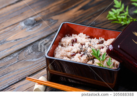 Sekihan served in a box (with Japanese sake) Sekihan served in a box (with Japanese sake) 105088388