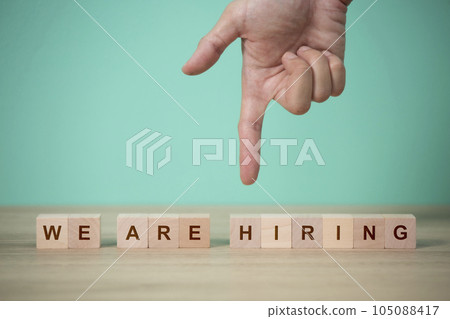 Job recruiting advertisement. represented by 'WE ARE HIRING' texts on the block. 105088417