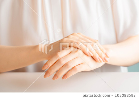 Woman doing hand self care Woman doing hand self care 105088592