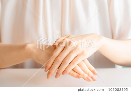 Woman doing hand self care 105088595
