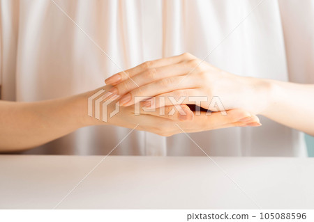 Woman doing hand self care 105088596