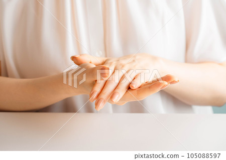 Woman doing hand self care 105088597