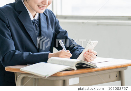 High school students and high school girls studying English using smartphone apps at school / cram school High school students and high school girls studying English using smartphone apps at school / cram school 105088767
