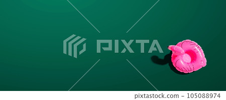 Summer concept with a pink flamingo float Summer concept with a pink flamingo float 105088974