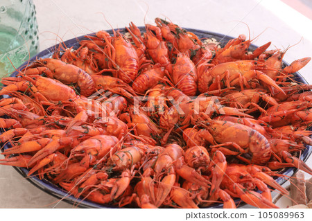 Boiled crayfish. Arranged on a large platter. Close-up. Boiled crayfish. Arranged on a large platter. Close-up. 105089963
