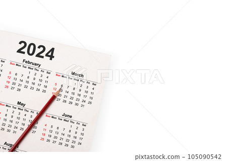 Calendar Year 2024 schedule with blank note for to do list on paper background. Flat lay with calendar, pencil on calander 2024. Close-up of pencil on page of calendar 2024. isolated on white 105090542