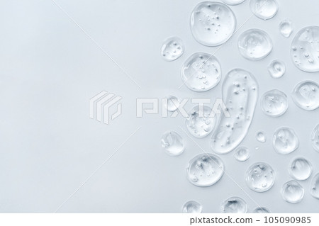 Drops of gel face serum top view. Abstract gel drops for design. Liquid gel moisturizer. Drops of gel face serum top view. Abstract gel drops for design. Liquid gel moisturizer. 105090985