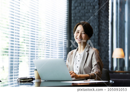 Female business computer looking at camera portrait smile Female business computer looking at camera portrait smile 105091053