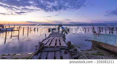 a wooden pier and boats 105091211
