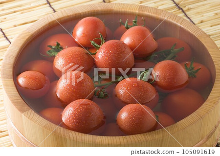 tomatoes in a bucket 105091619