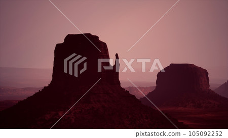 Sunset at the sisters in Monument Valley Sunset at the sisters in Monument Valley 105092252