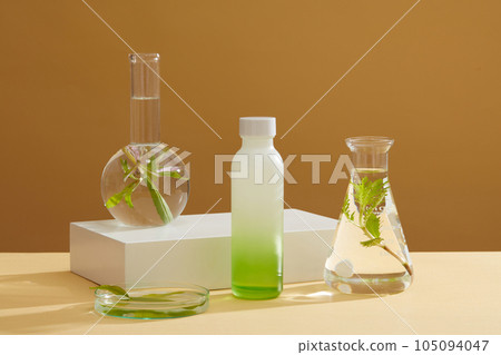 Unbranded bottle in gradient green color displayed several glassware filled with water and seaweed. Seaweed is ideal for dry and aging skin types Unbranded bottle in gradient green color displayed several glassware filled with water and seaweed. Seaweed is ideal for dry and aging skin types 105094047