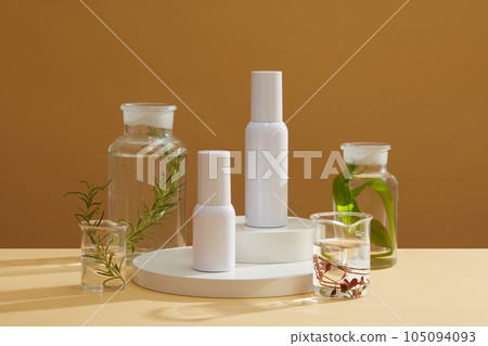 Some glassware containing seaweed displayed with blank label cosmetic container. Front view. Seaweed helping to pull moisture from the air into your skin Some glassware containing seaweed displayed with blank label cosmetic container. Front view. Seaweed helping to pull moisture from the air into your skin 105094093