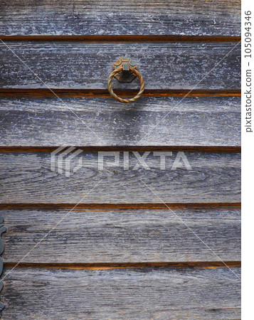 A door knocker is a fixture on the front door of a house. It is made of metal and has the form of a ring, is knocked on the metal part of the door knocker fixed to the wall. Herceg Novi, Montenegro A door knocker is a fixture on the front door of a house. It is made of metal and has the form of a ring, is knocked on the metal part of the door knocker fixed to the wall. Herceg Novi, Montenegro 105094346