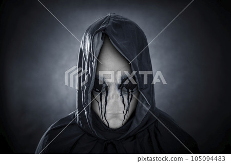 Mysterious humanoid alien in blood at night over dark misty background 105094483