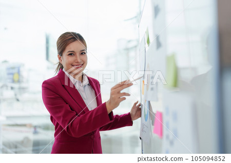 Business leader pointing at goals plan and analyze financial data for long term investments Business leader pointing at goals plan and analyze financial data for long term investments 105094852