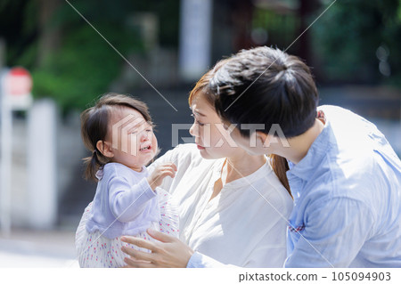 A couple comforting a crying child A couple comforting a crying child 105094903
