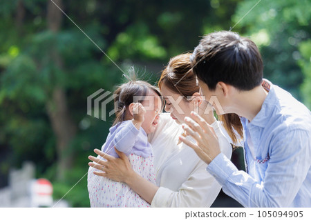 A couple comforting a crying child A couple comforting a crying child 105094905