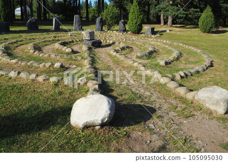 Stone labyrinth near the Devil's Stul rock on Lake Onega. Zaozerye, Petrozavodsk, Karelia, Russia. A magical place for the rituals of the ancient Karelians and Finns. Ethnographic northern tourism Stone labyrinth near the Devil's Stul rock on Lake Onega. Zaozerye, Petrozavodsk, Karelia, Russia. A magical place for the rituals of the ancient Karelians and Finns. Ethnographic northern tourism 105095030