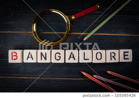 BANGALORE. City name from alphabet blocks on dark wood texture background 105095426