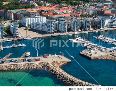 View of the Helsinborg city centre and the port of Helsingborg in Sweden. Old town by the beach and city port in Helsingborg harbour. Beautiful aerial view. View of the Helsinborg city centre and the port of Helsingborg in Sweden. Old town by the beach and city port in Helsingborg harbour. Beautiful aerial view. 105097136