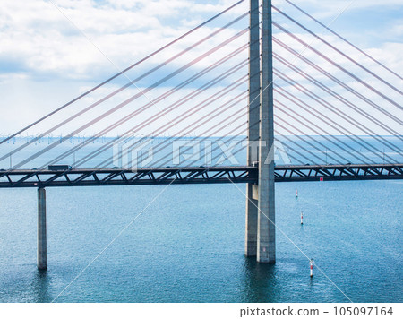 Panoramic aerial close up view of Oresund bridge over the Baltic sea between Malmo city in Sweden and Copenhagen in Denmark. 105097164