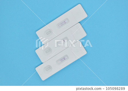 covid test kit on blue background covid test kit on blue background 105098289