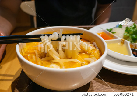 Laksa noodles. A dish of rice noodles in a spicy spice soup. 105099271