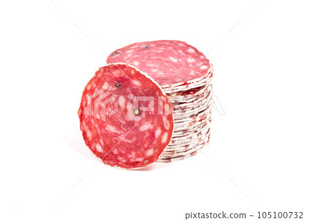 Slices of salami sausage on a white background Slices of salami sausage on a white background 105100732