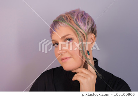Cute beautiful girl portrait caucasian looking at the camera with stylish hairstyle colored bob coloring on studio background 105100906