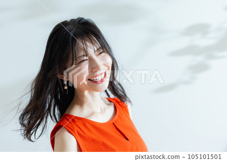 A middle-aged woman in a red dress A middle-aged woman in a red dress 105101501