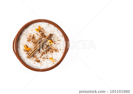 Arroz con leche. Rice pudding in white bowl isolated on white background 105101980