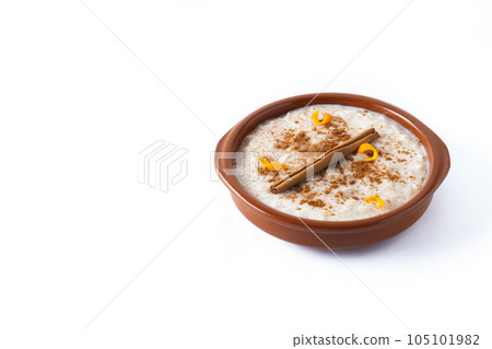 Arroz con leche. Rice pudding in white bowl isolated on white background 105101982