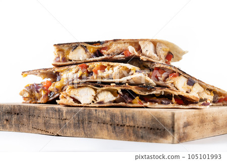 Mexican quesadilla with chicken, cheese and peppers isolated on white background 105101993